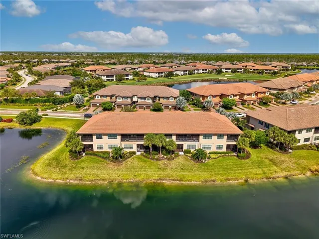 a balcony with table and chairs
