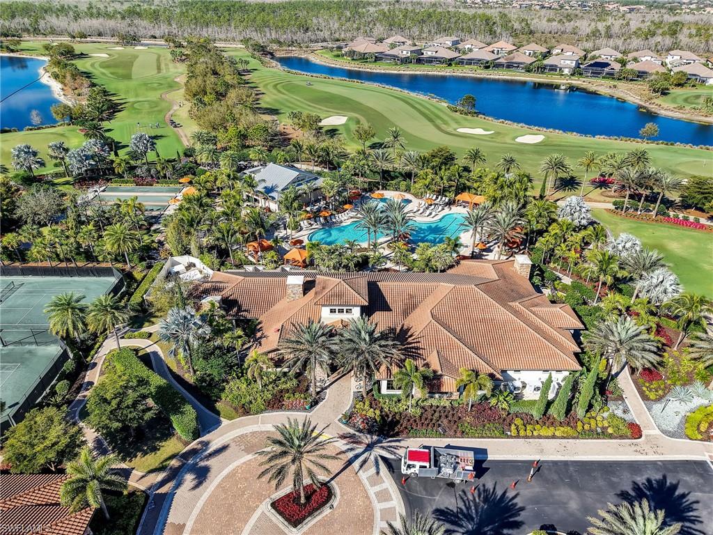9685 Montelanico Loop, Unit 202 Naples, FL 34119 - Photo 36 of 41 an aerial view of residential houses with outdoor space and swimming pool