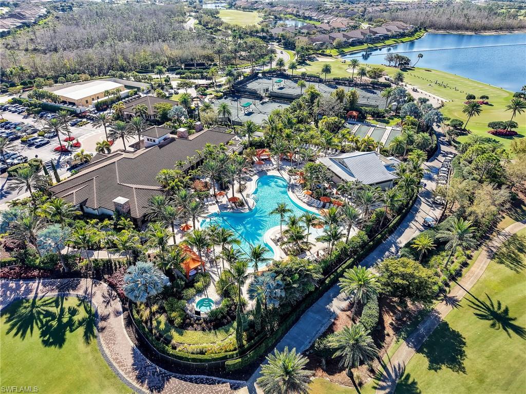 9685 Montelanico Loop, Unit 202 Naples, FL 34119 - Photo 40 of 41 an aerial view of a house with a yard and lake view in back