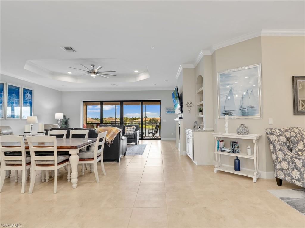 9685 Montelanico Loop, Unit 202 Naples, FL 34119 - Photo 6 of 41 a view of a livingroom with furniture and window