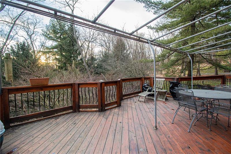 110 Shadow Ridge Drive Pittsburgh, PA 15238 - Photo 25 of 25 Back deck off kitchen and den with access to driveway and lower back yard which features large water feature.