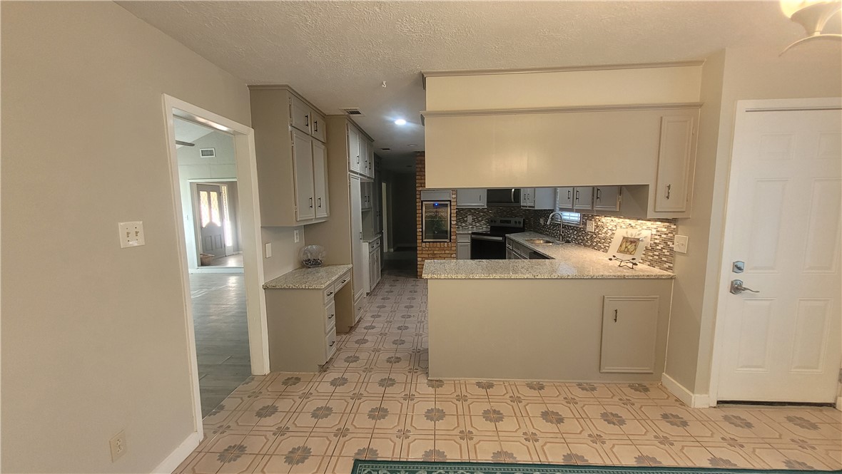 1010 Holt Street College Station, TX 77840 - Photo 11 of 14 a bathroom with a sink and a mirror