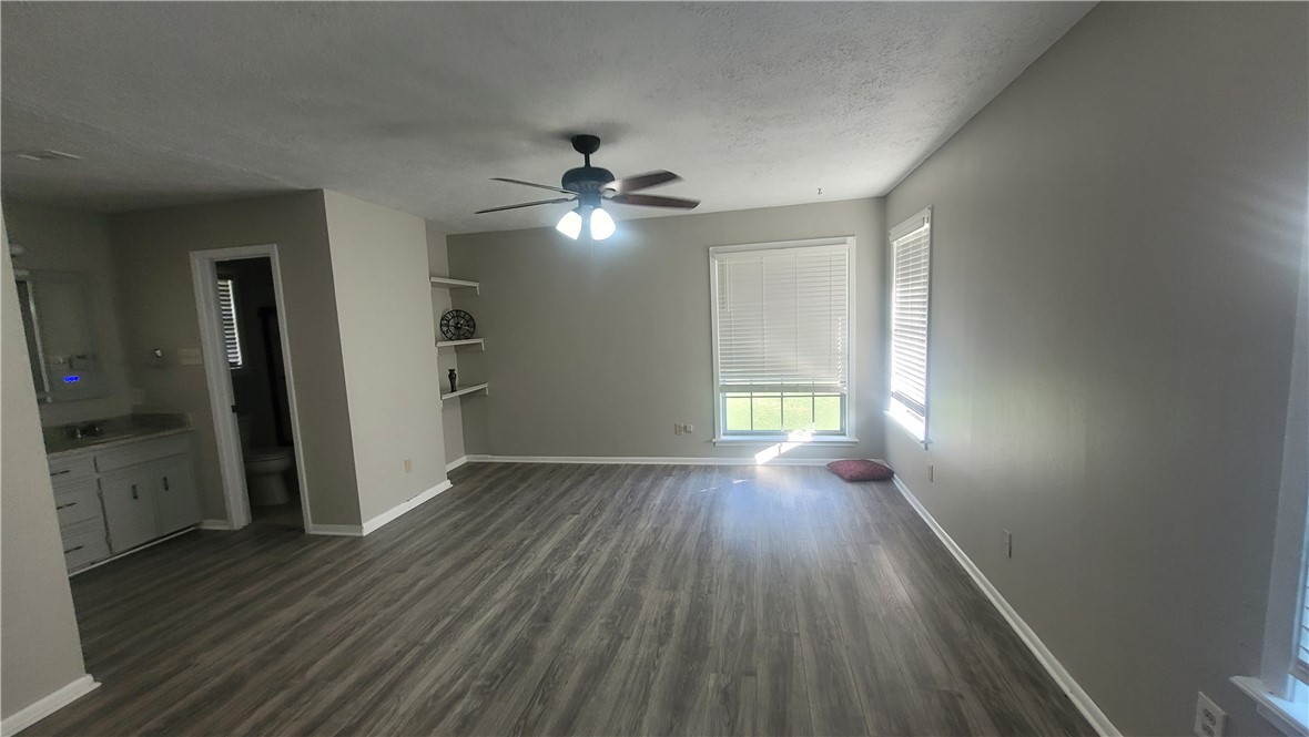 1010 Holt Street College Station, TX 77840 - Photo 12 of 14 wooden floor in an empty room with a window