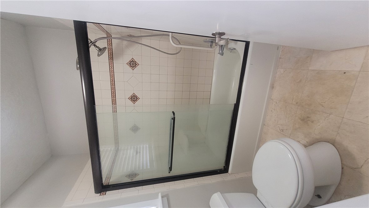 1010 Holt Street College Station, TX 77840 - Photo 14 of 14 a bathroom with a toilet and a shower