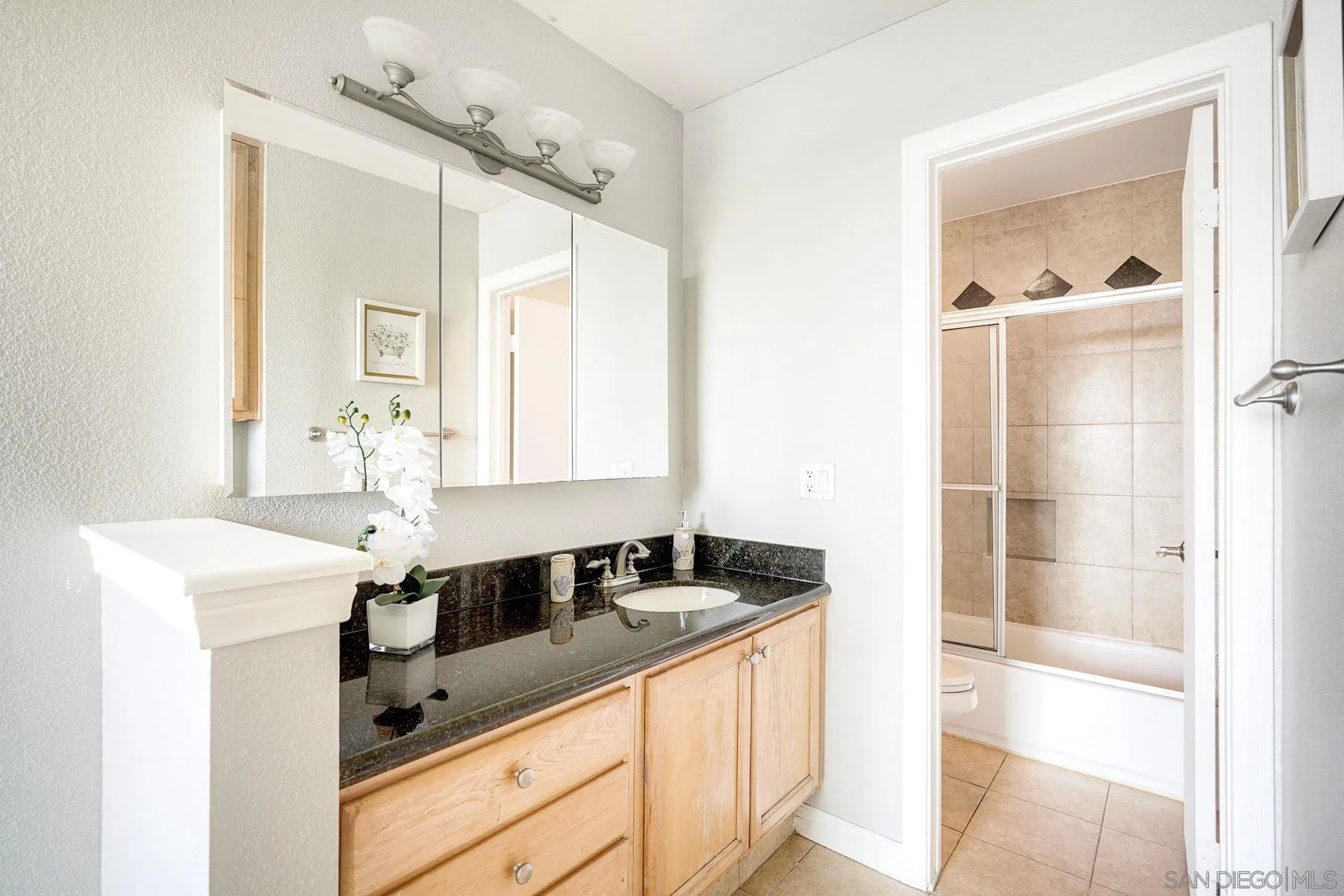 4860 Rolando Court, Unit 75 San Diego, CA 92115 - Photo 12 of 20 a kitchen with a sink and a refrigerator