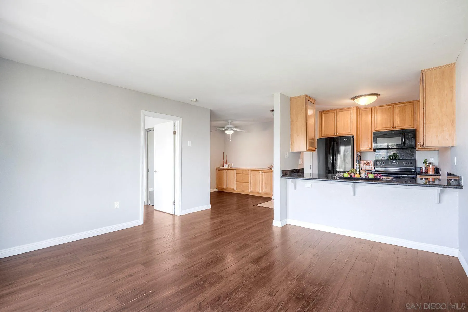 4860 Rolando Court, Unit 75 San Diego, CA 92115 - Photo 2 of 20 a view of a kitchen with a sink and a stove top oven