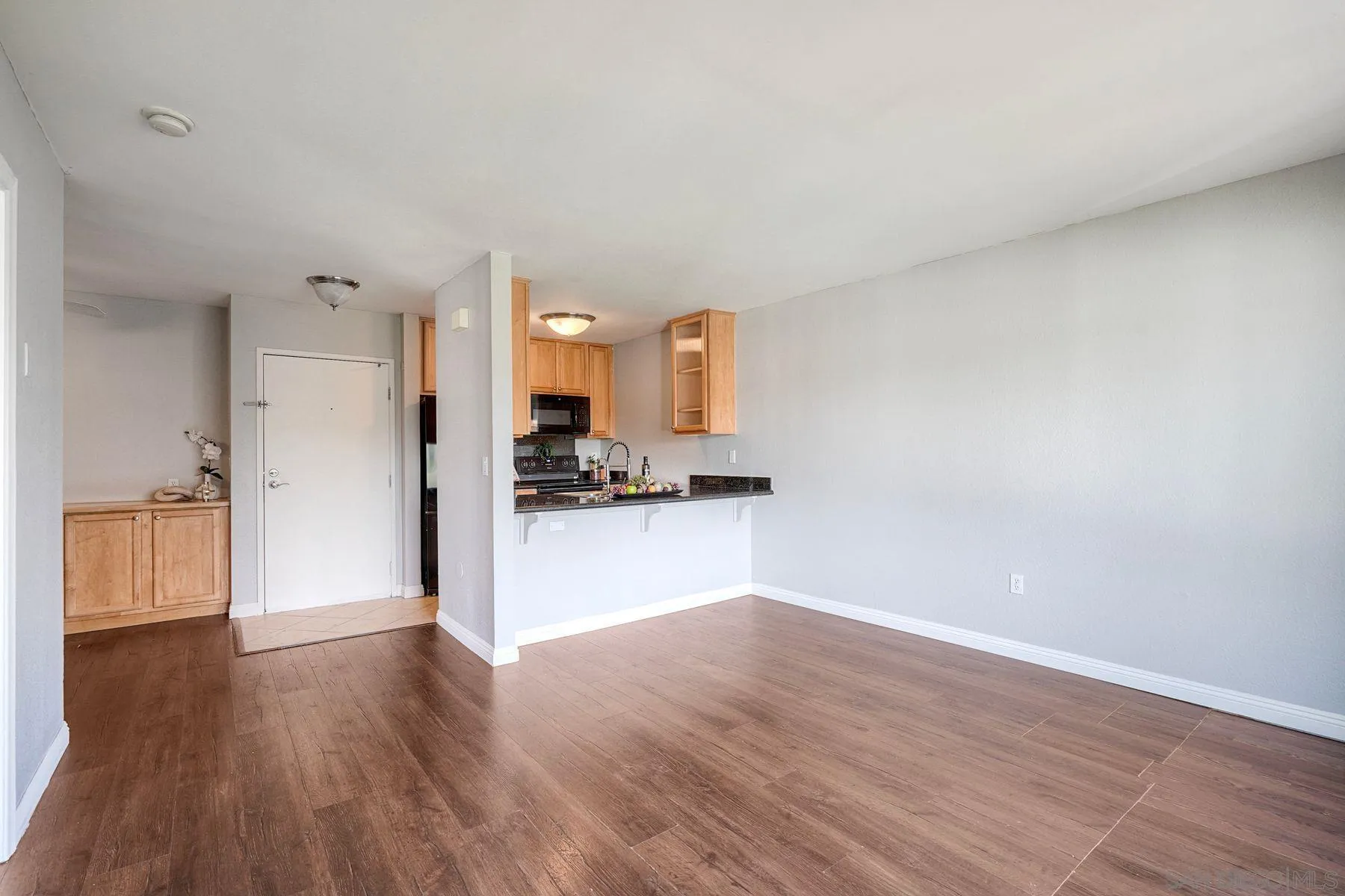 4860 Rolando Court, Unit 75 San Diego, CA 92115 - Photo 3 of 20 a view of empty room with wooden floor