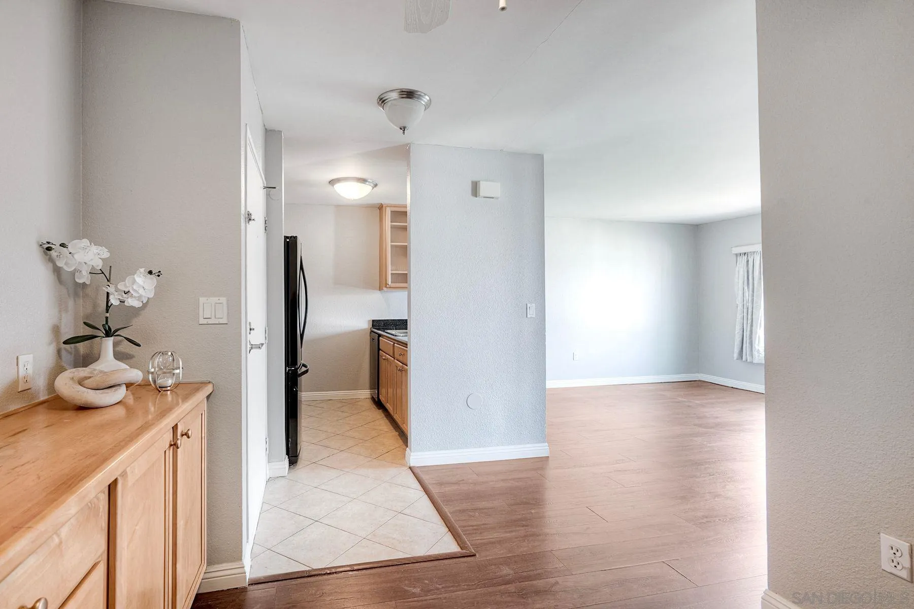 4860 Rolando Court, Unit 75 San Diego, CA 92115 - Photo 4 of 20 a view of a kitchen from the hallway
