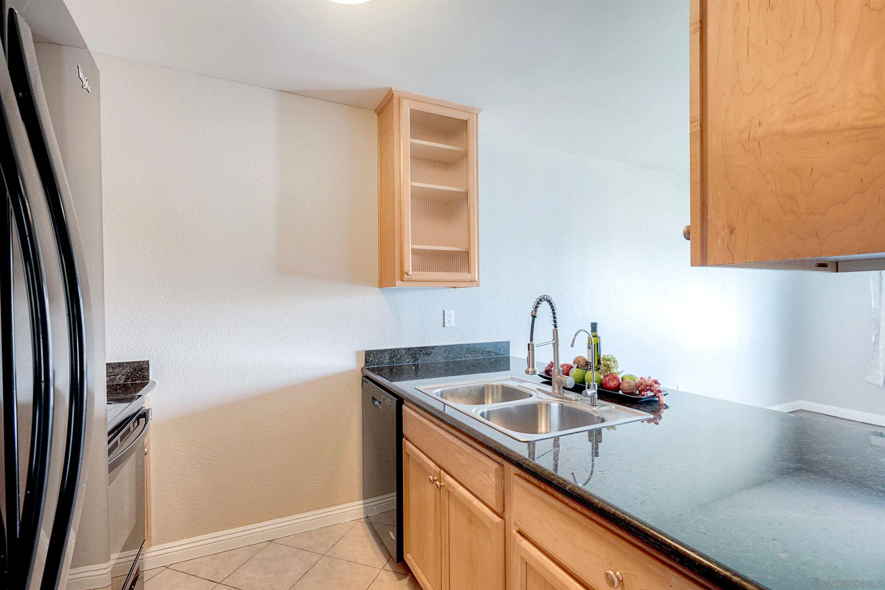 4860 Rolando Court, Unit 75 San Diego, CA 92115 - Photo 5 of 20 a kitchen with a sink cabinets and a window