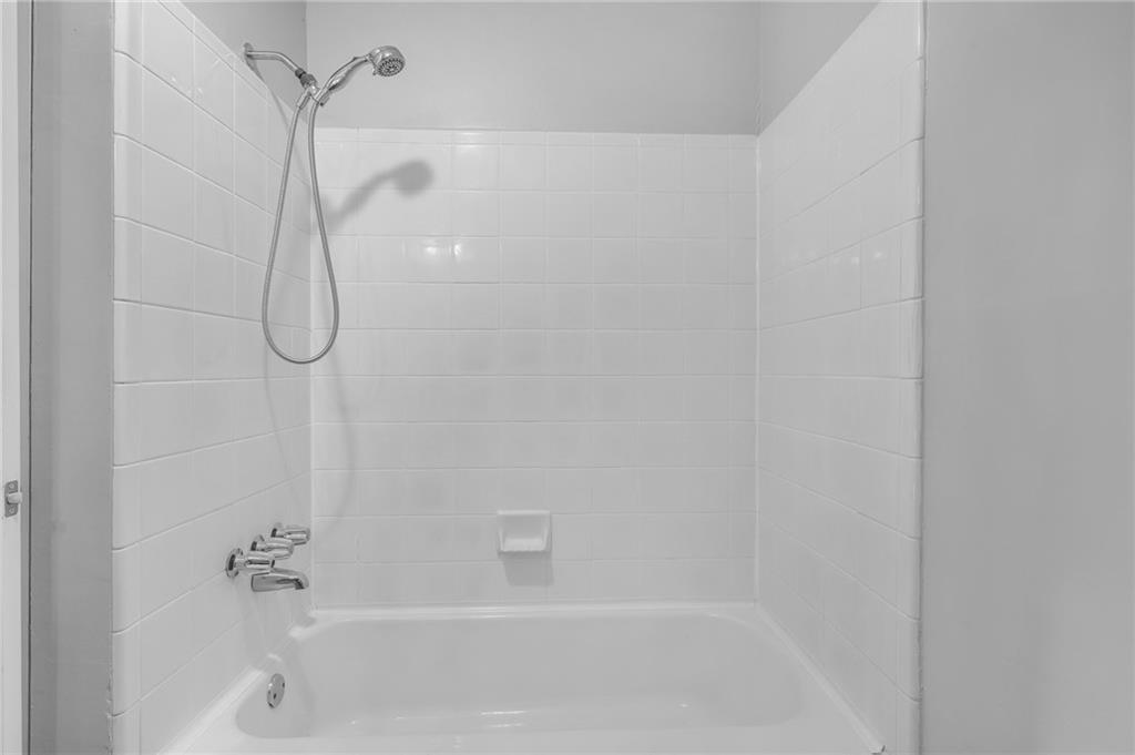 1150 Collier Road Northwest, Unit 2J Atlanta, GA 30318 - Photo 19 of 41 a close up of a bathtub