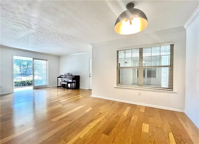 a view of livingroom with furniture wooden floor and window
