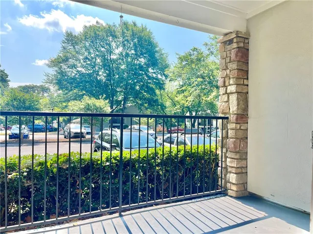 a view of balcony with wooden floor