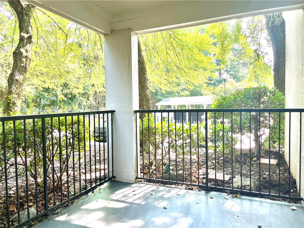 1150 Collier Road Northwest, Unit 2J Atlanta, GA 30318 - Photo 23 of 41 a view of a garden with a lake view