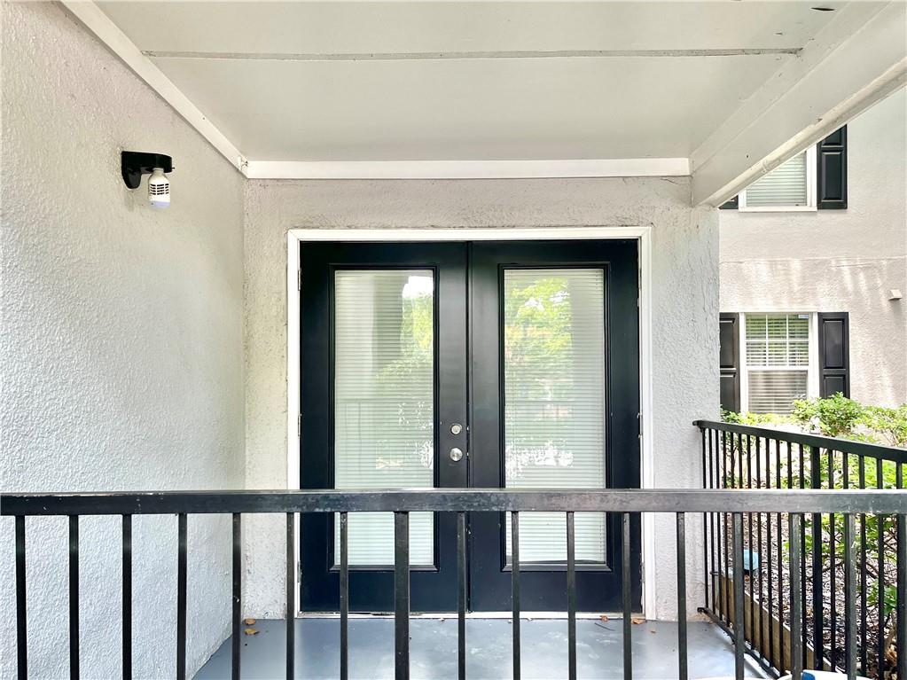 1150 Collier Road Northwest, Unit 2J Atlanta, GA 30318 - Photo 24 of 41 a view of a porch with a furniture