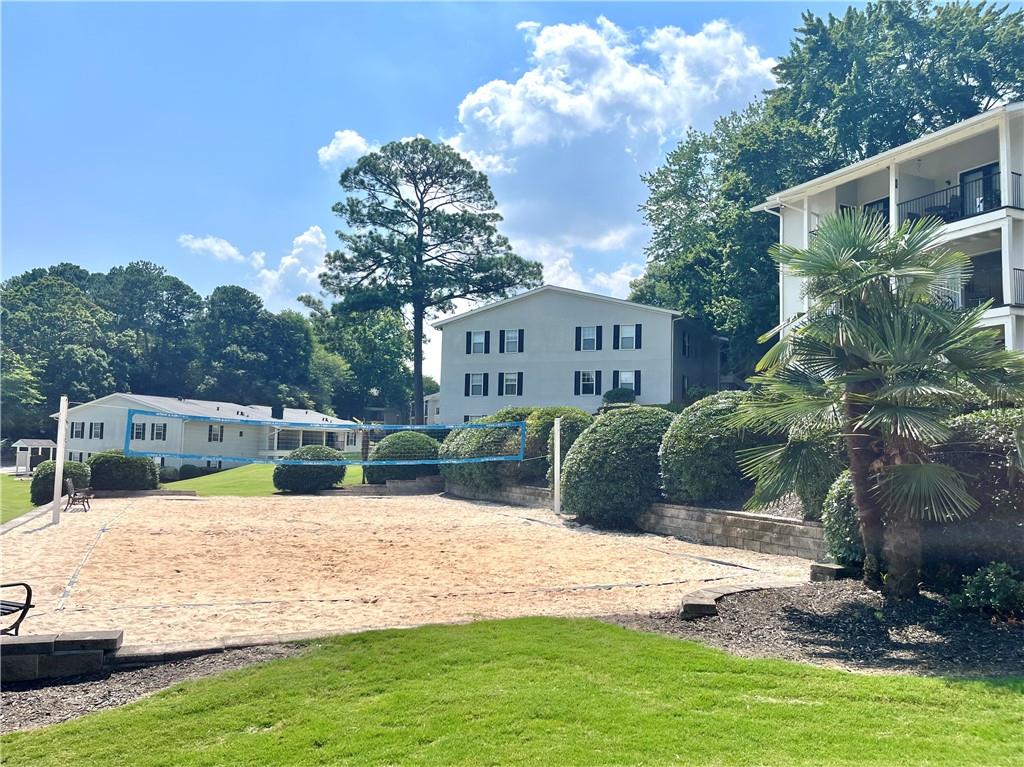 1150 Collier Road Northwest, Unit 2J Atlanta, GA 30318 - Photo 30 of 33 a view of a house with backyard and sitting area