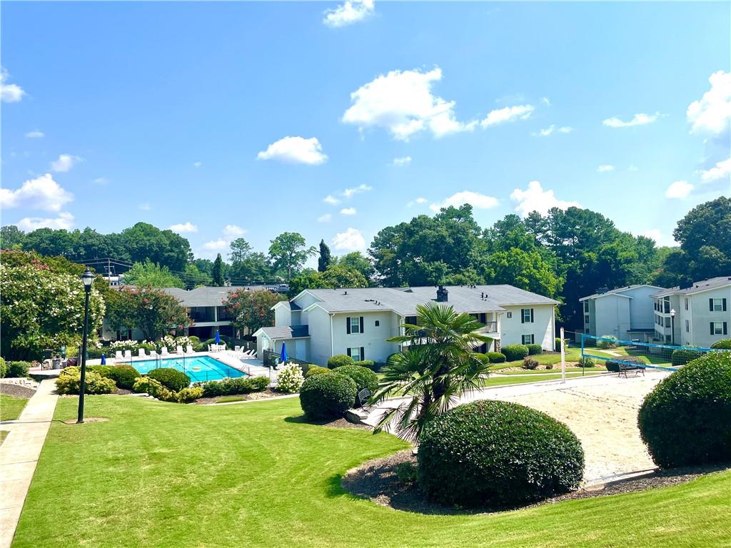 1150 Collier Road Northwest, Unit 2J Atlanta, GA 30318 - Photo 32 of 33 a swimming pool view with a seating space