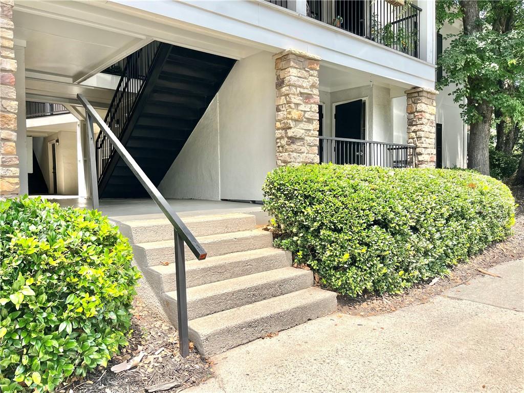 1150 Collier Road Northwest, Unit 2J Atlanta, GA 30318 - Photo 36 of 41 a view of a house with a yard