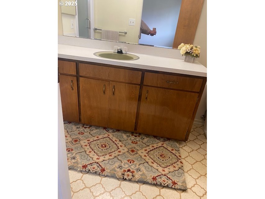 3308 Wisteria Street Eugene, OR 97404 - Photo 12 of 19 a bathroom with a sink and a mirror