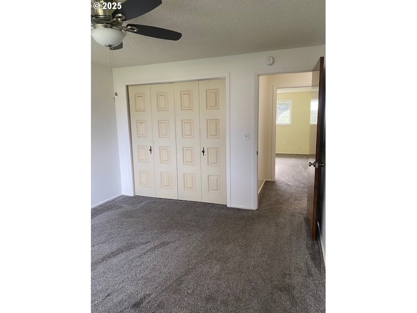 3308 Wisteria Street Eugene, OR 97404 - Photo 13 of 19 a view of a room with a closet and mirror