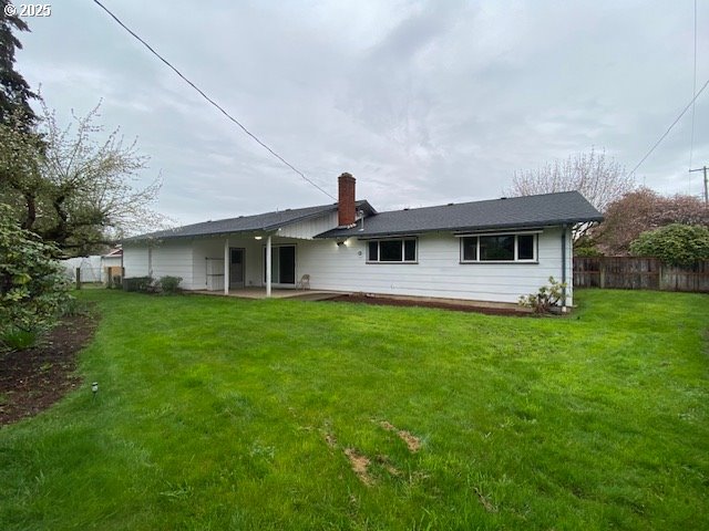3308 Wisteria Street Eugene, OR 97404 - Photo 15 of 19 a front view of a house with a garden