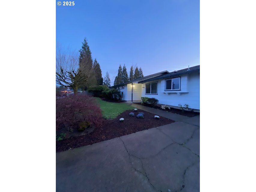 3308 Wisteria Street Eugene, OR 97404 - Photo 3 of 19 a picture of a house with a yard
