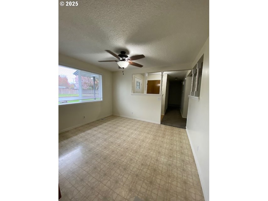 3308 Wisteria Street Eugene, OR 97404 - Photo 5 of 19 a view of an empty room with a chandelier