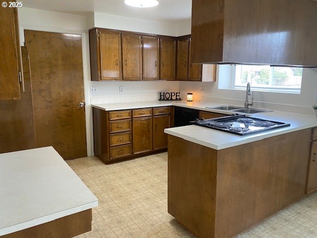 3308 Wisteria Street Eugene, OR 97404 - Photo 6 of 19 a kitchen with stainless steel appliances a stove a sink a refrigerator and cabinets