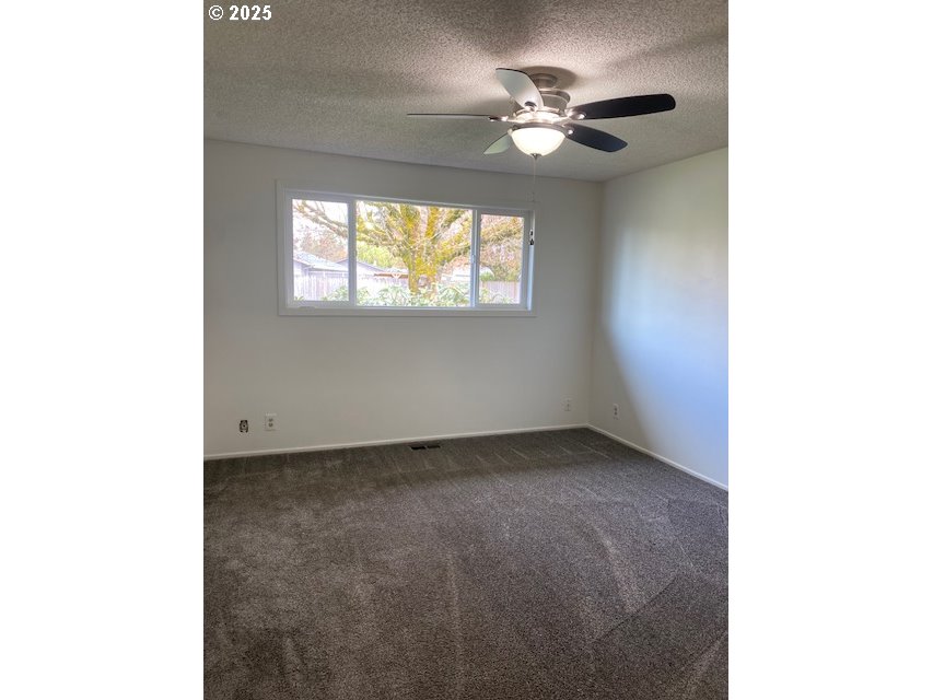 3308 Wisteria Street Eugene, OR 97404 - Photo 9 of 19 a view of an empty room with a window