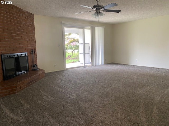 3308 Wisteria Street Eugene, OR 97404 - Photo 10 of 19 a view of an empty room with a fireplace and a window