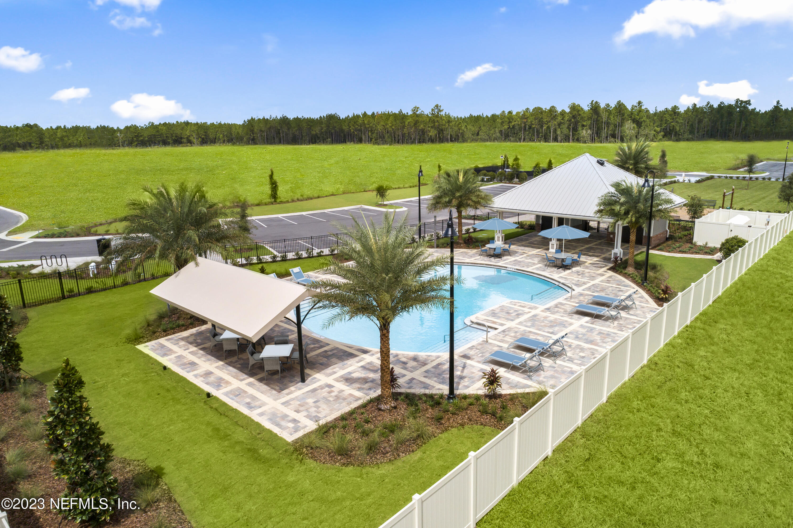 9883 Fiddleback Lane Jacksonville, FL 32222 - Photo 11 of 12 a view of a lake with couches and city view