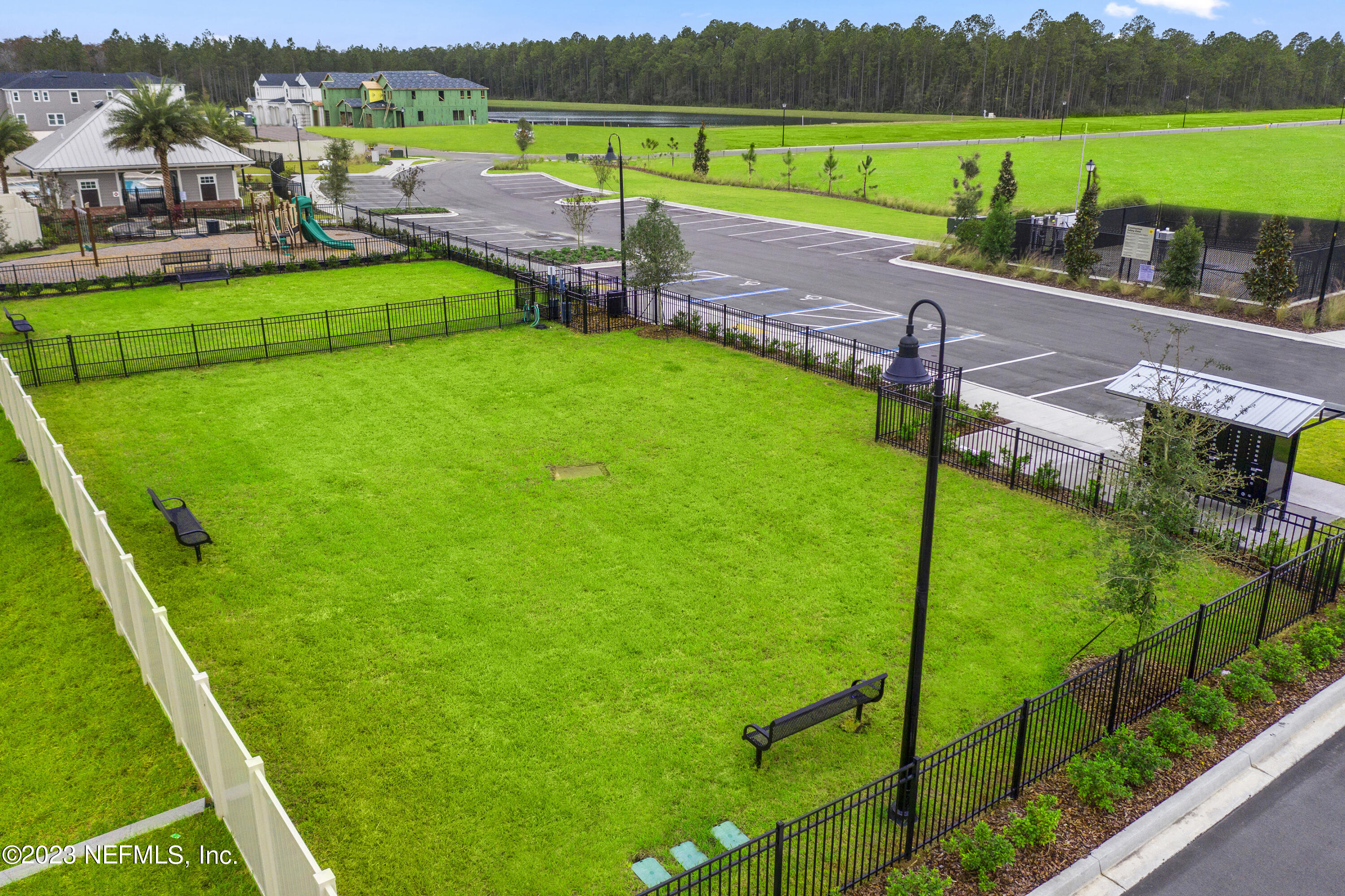 9883 Fiddleback Lane Jacksonville, FL 32222 - Photo 9 of 12 a view of yard with seating area and mountains in the background