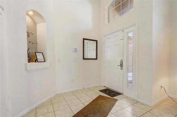 a view of a a dining room with furniture window and wooden floor