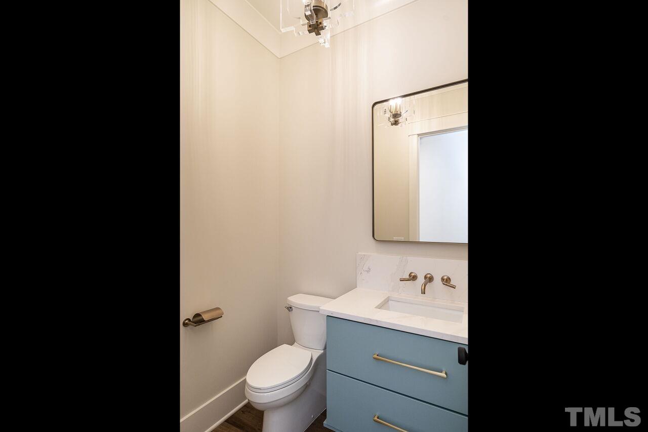 1104 Shelley Road Raleigh, NC 27609 - Photo 11 of 45 a bathroom with a granite countertop sink toilet and shower