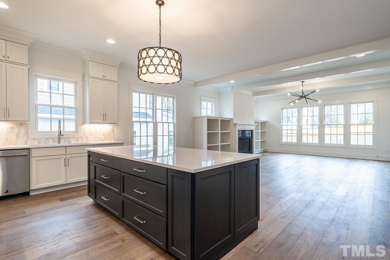 1104 Shelley Road Raleigh, NC 27609 - Photo 12 of 45 a kitchen with a counter space a window and wooden floor