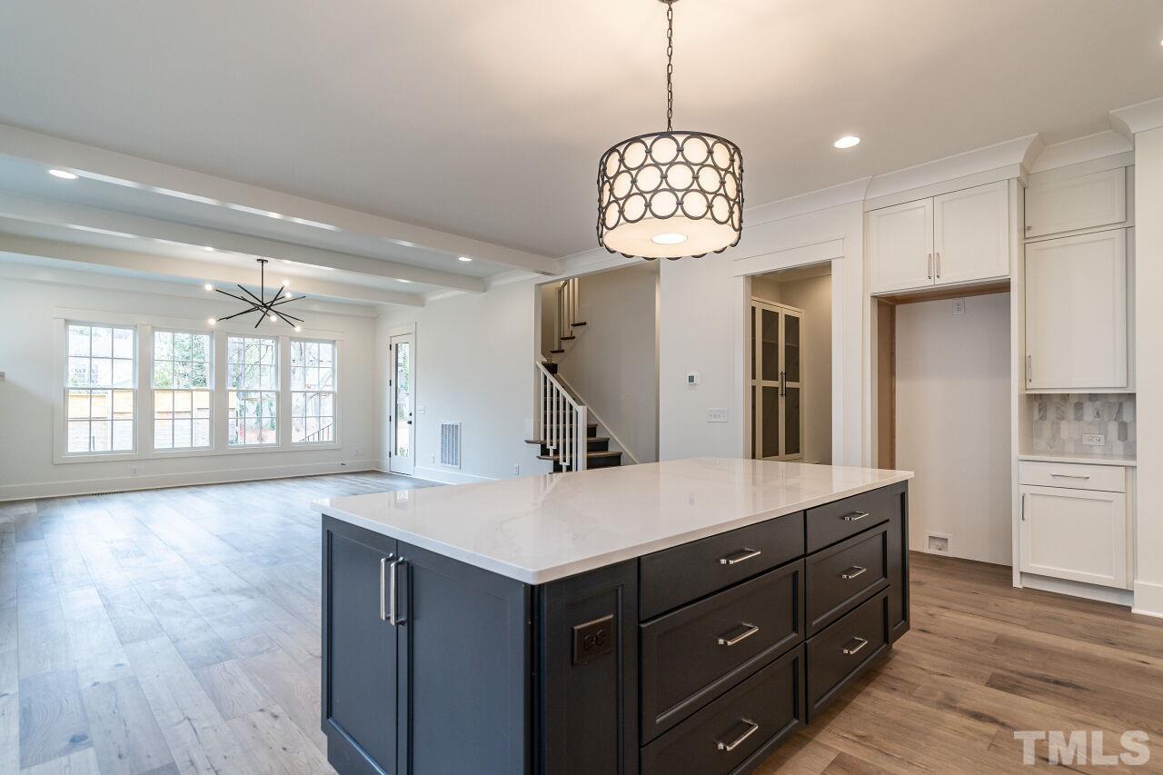 1104 Shelley Road Raleigh, NC 27609 - Photo 18 of 45 a view of a kitchen center island and stainless steel appliances