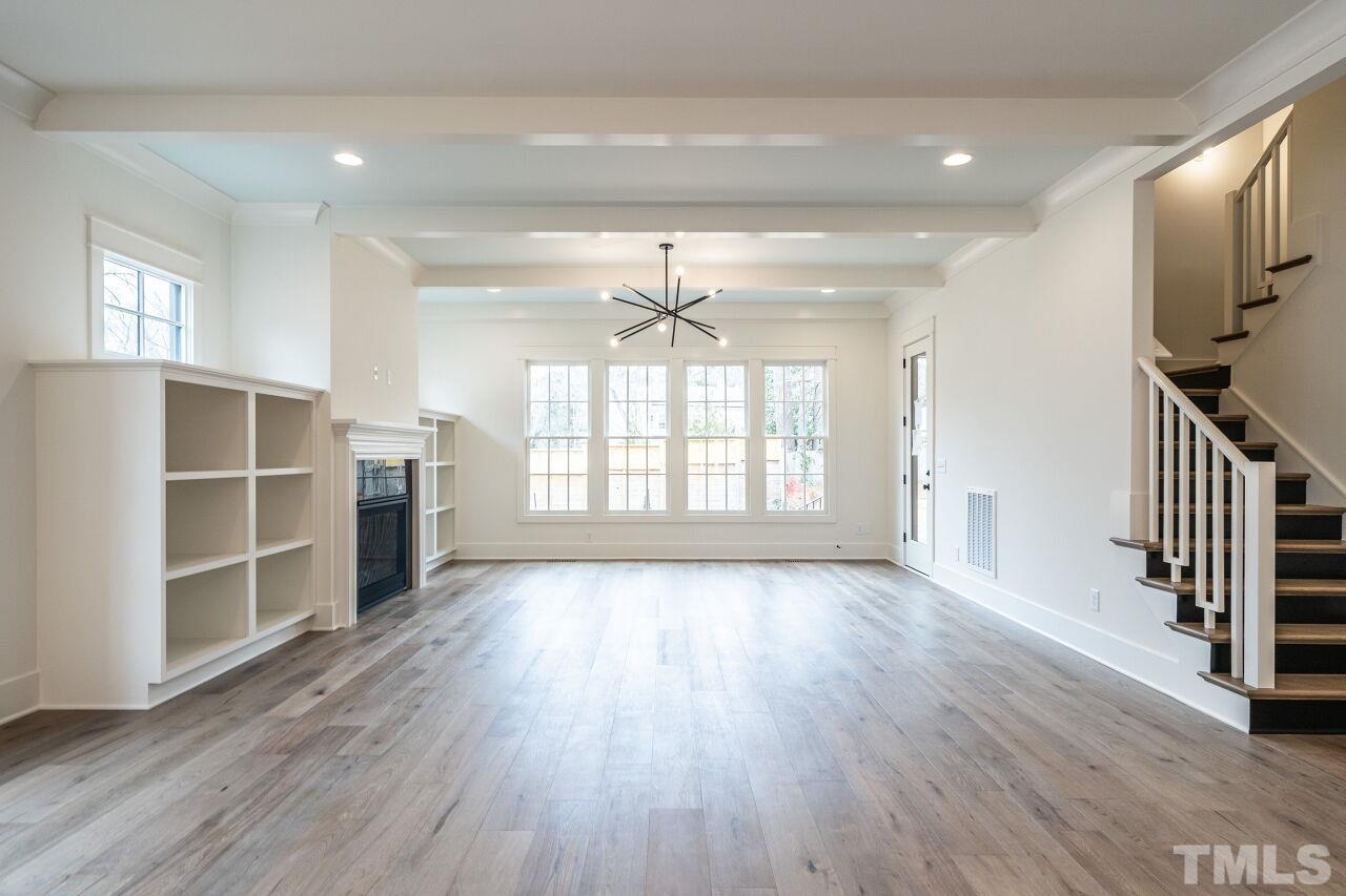 1104 Shelley Road Raleigh, NC 27609 - Photo 21 of 45 an empty room with wooden floor and windows