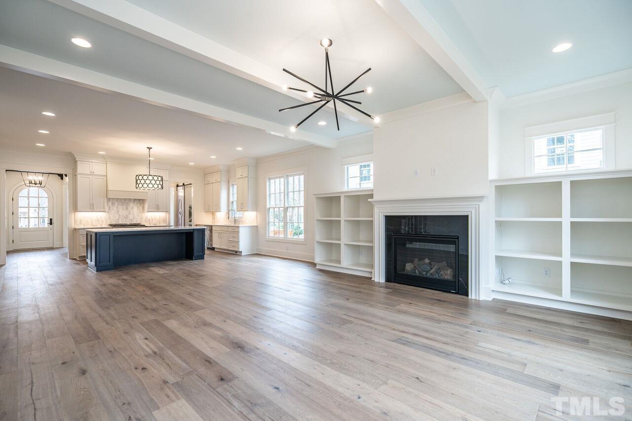 1104 Shelley Road Raleigh, NC 27609 - Photo 25 of 45 a view of an empty room with a fireplace and window