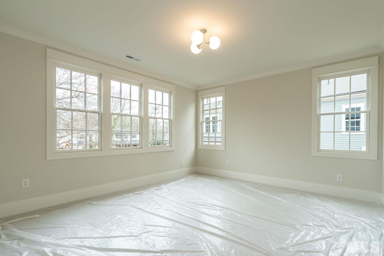 1104 Shelley Road Raleigh, NC 27609 - Photo 30 of 45 a view of an empty room with a window