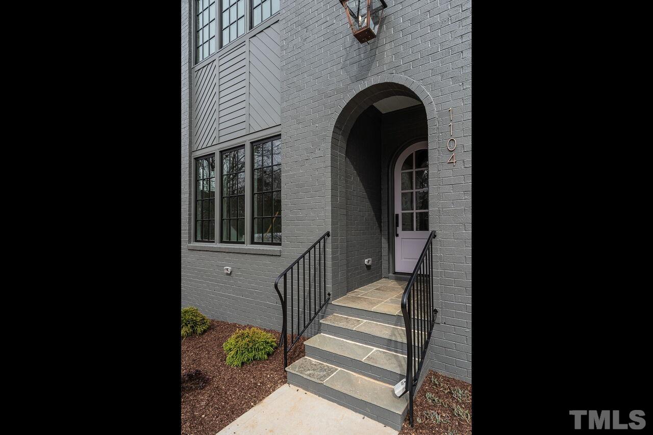 1104 Shelley Road Raleigh, NC 27609 - Photo 3 of 45 a view of a balcony with wooden floor and stairs