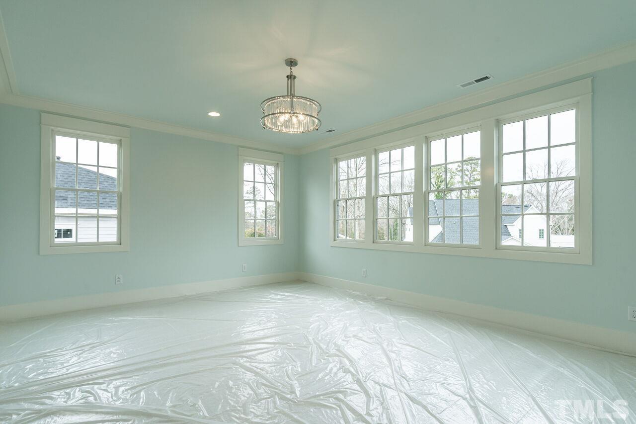 1104 Shelley Road Raleigh, NC 27609 - Photo 32 of 45 a view of an empty room with a window