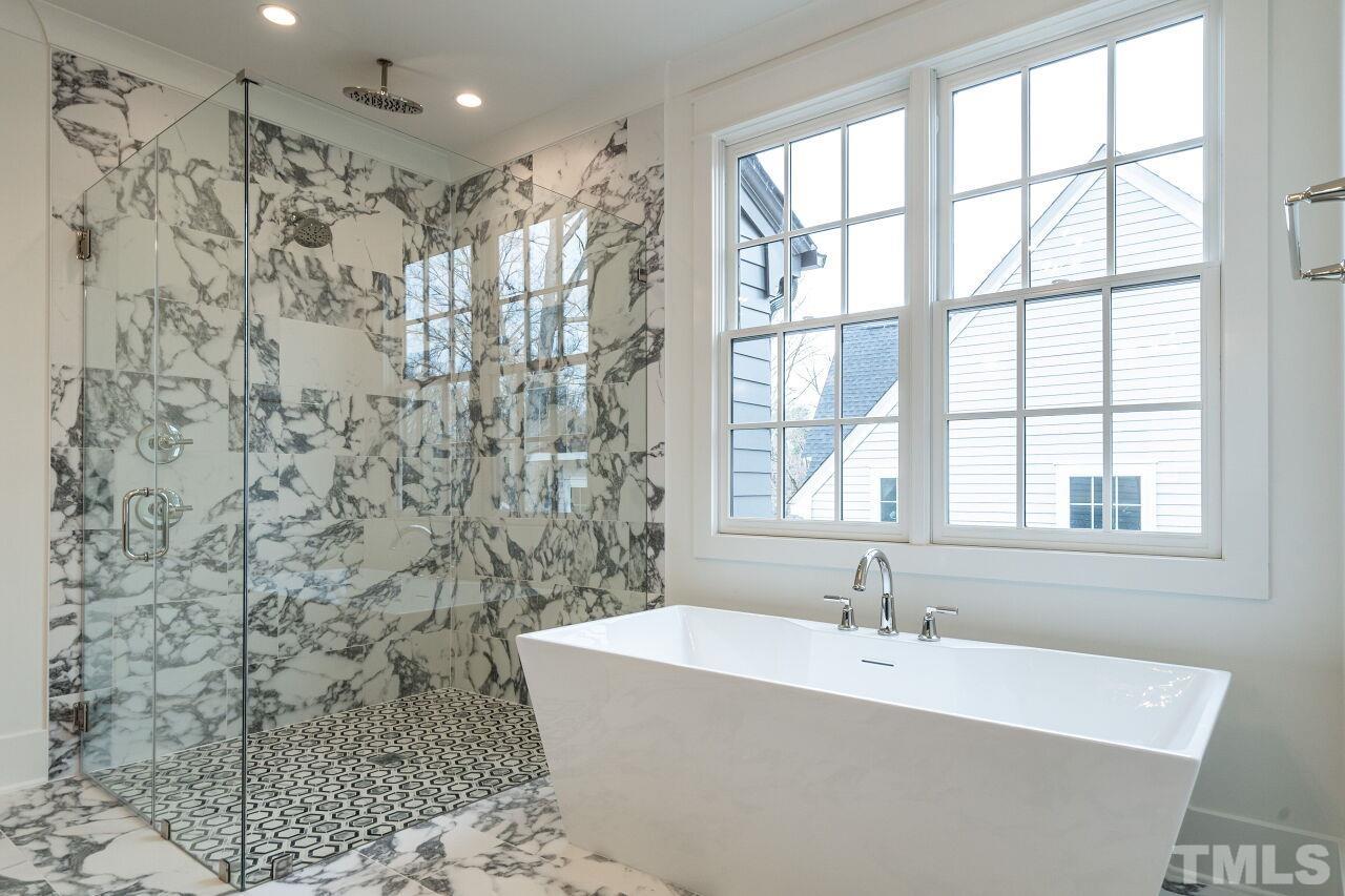 1104 Shelley Road Raleigh, NC 27609 - Photo 35 of 45 a bathroom with a bathtub and shower