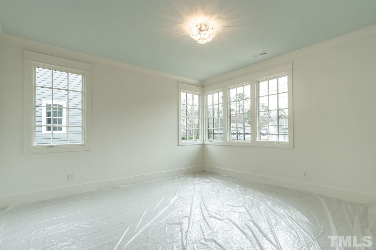 1104 Shelley Road Raleigh, NC 27609 - Photo 37 of 45 a view of an empty room with a window
