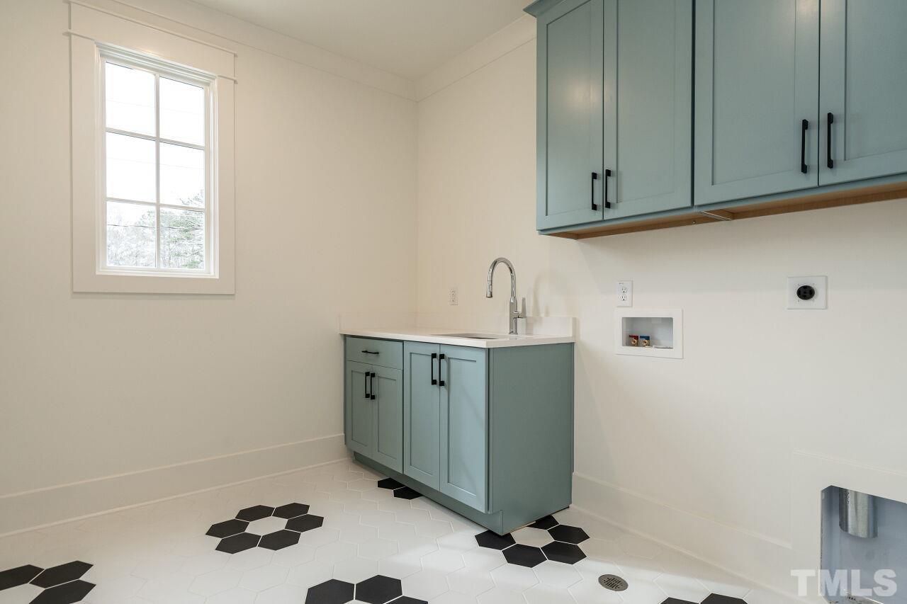 1104 Shelley Road Raleigh, NC 27609 - Photo 39 of 45 a room with cabinets and a window