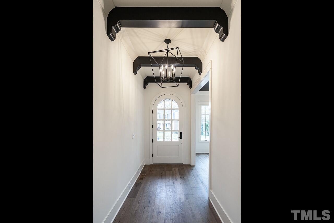 1104 Shelley Road Raleigh, NC 27609 - Photo 4 of 45 a view of entryway with wooden floor
