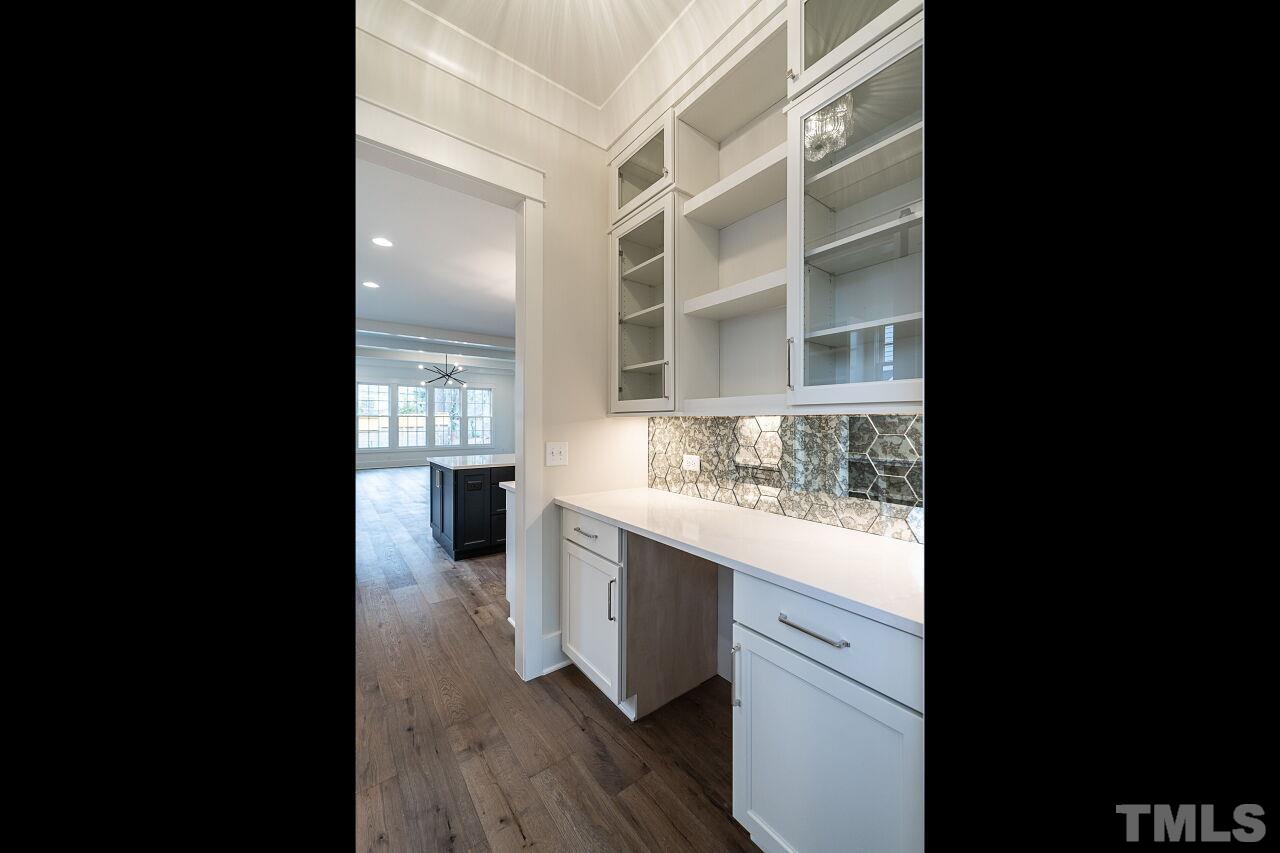 1104 Shelley Road Raleigh, NC 27609 - Photo 8 of 45 a view of cabinets and wooden floor
