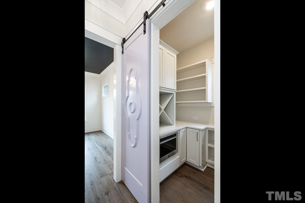 1104 Shelley Road Raleigh, NC 27609 - Photo 9 of 45 a view of walk in closet with empty racks