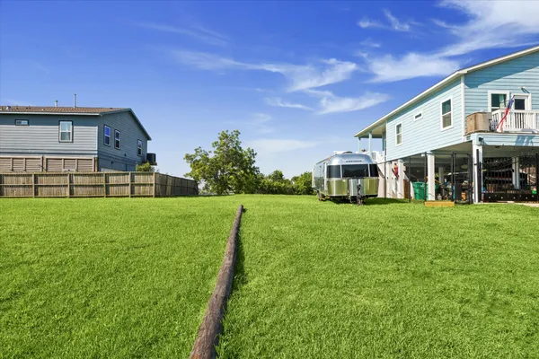 a view of house with backyard