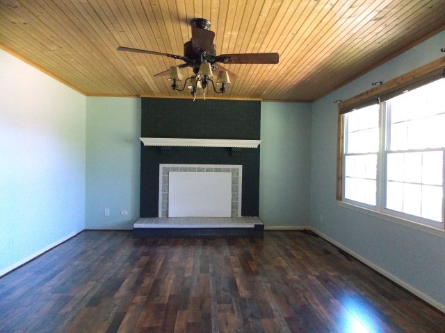 12698 Versailles Road Rockvale, TN 37153 - Photo 15 of 30 a view of empty room with wooden floor and fan