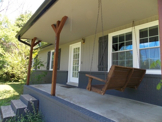12698 Versailles Road Rockvale, TN 37153 - Photo 6 of 30 a front view of a house with garden