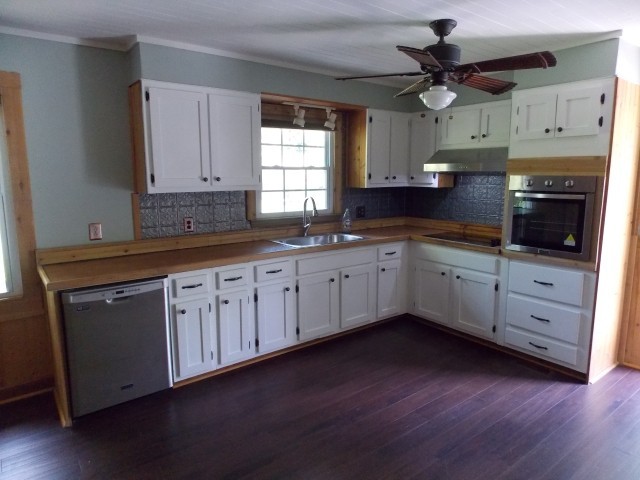12698 Versailles Road Rockvale, TN 37153 - Photo 9 of 30 a kitchen with sink cabinets and wooden floor